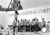 Negative 53198.16: A stilt dance to steel drums in Mount Morris Park (now Marcus Garvey Park) as part of the Harlem Cultural Festival on July 28, 1968.  Photo: Daniel McPartlin
